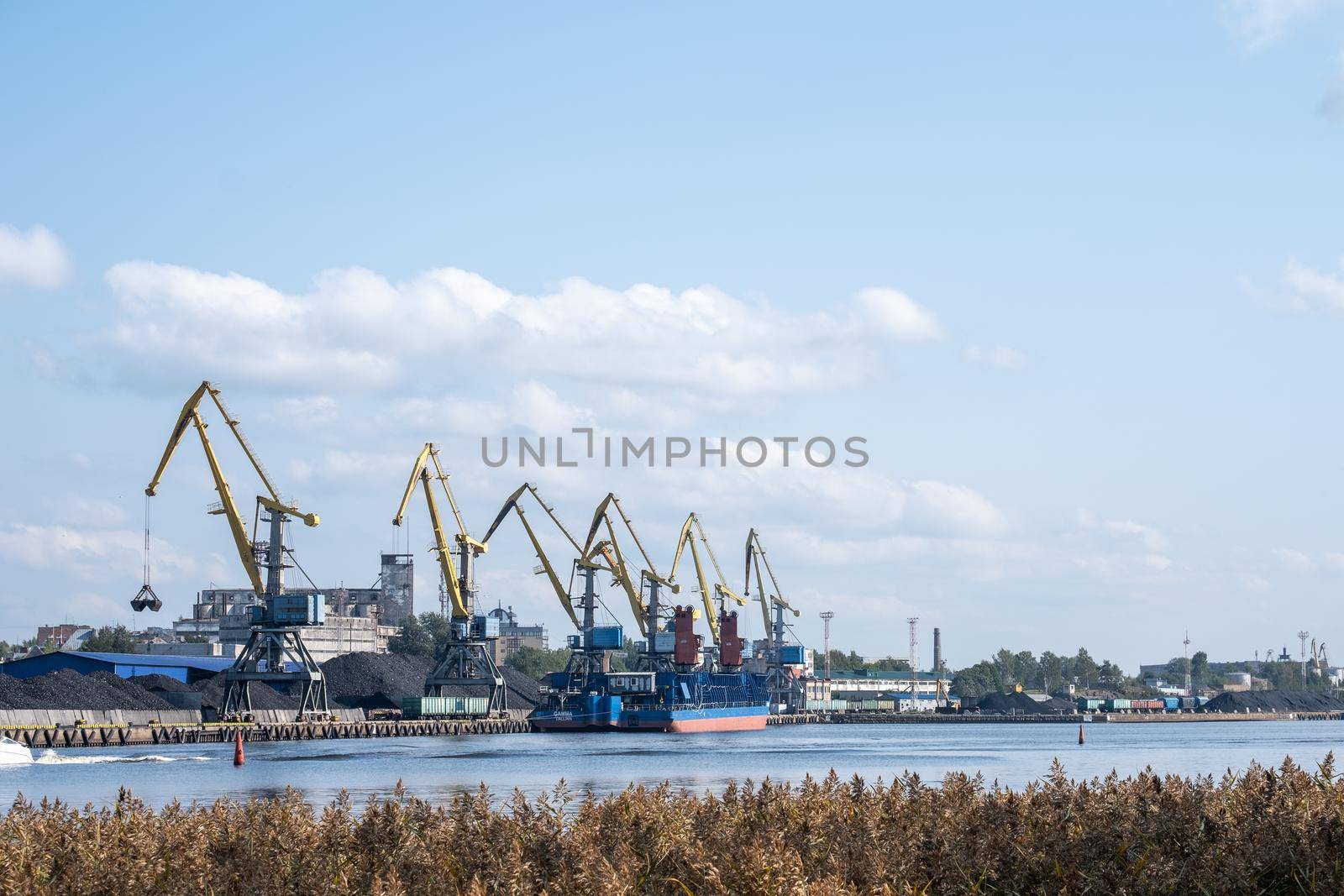 Vyborg, Leningrad region, Russia. - August 27, 2022. View of the commercial port with cargo cranes. Selective focus.