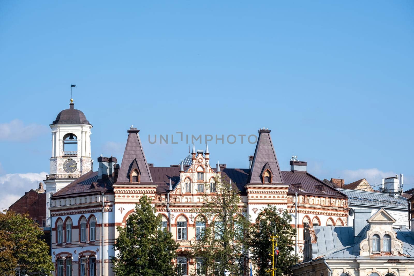 Old residential building and the historic Clock Tower Vyborg city by OlgaGubskaya