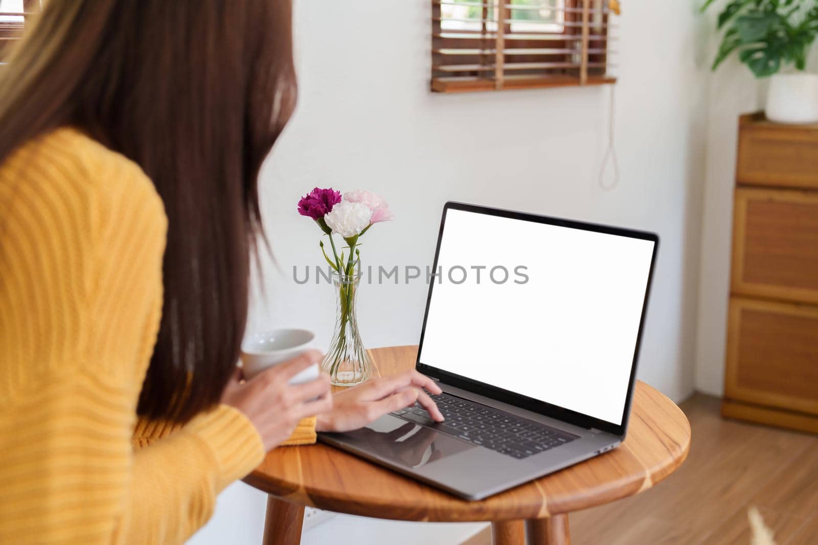 woman working on a white screen computer by Manastrong