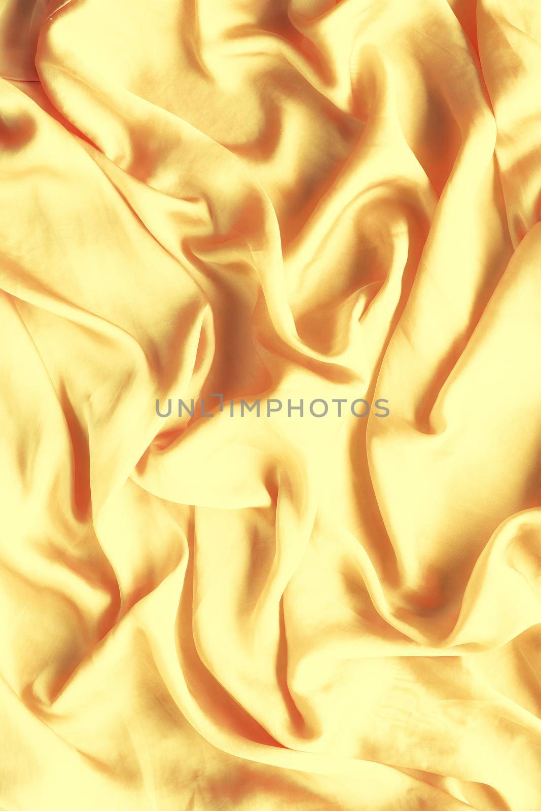 Luxury golden silk background texture - elegant fabric textures, abstract backgrounds and modern pastel colours concept