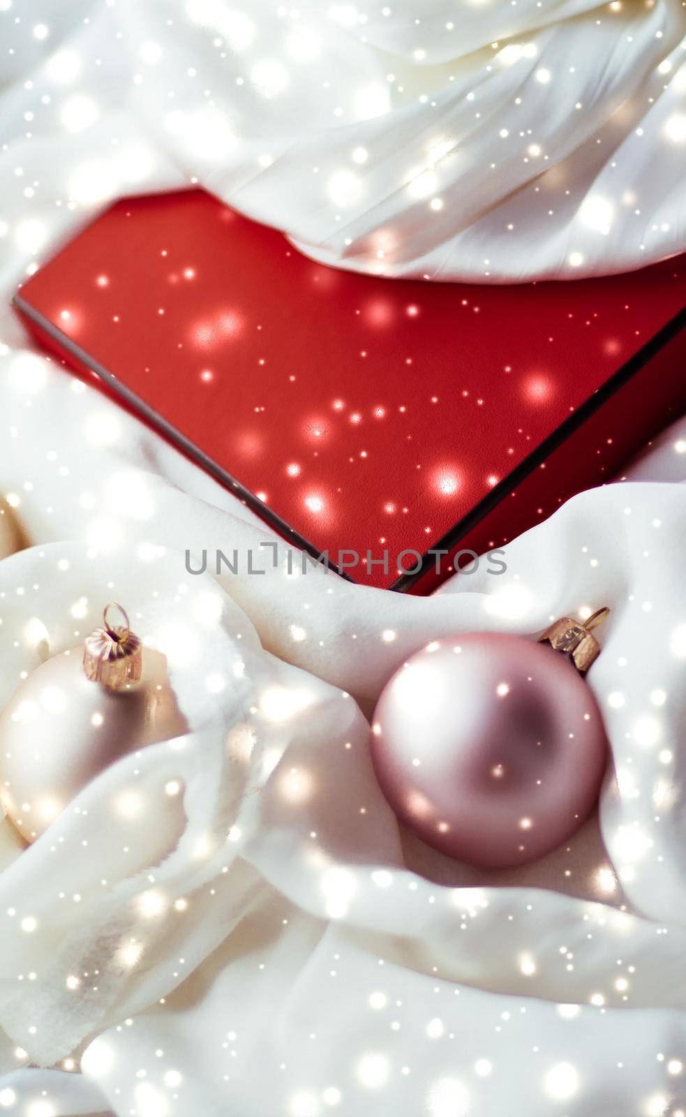 Winter, celebration and new years eve concept - Christmas decoration with shiny snow on silk background, holiday season