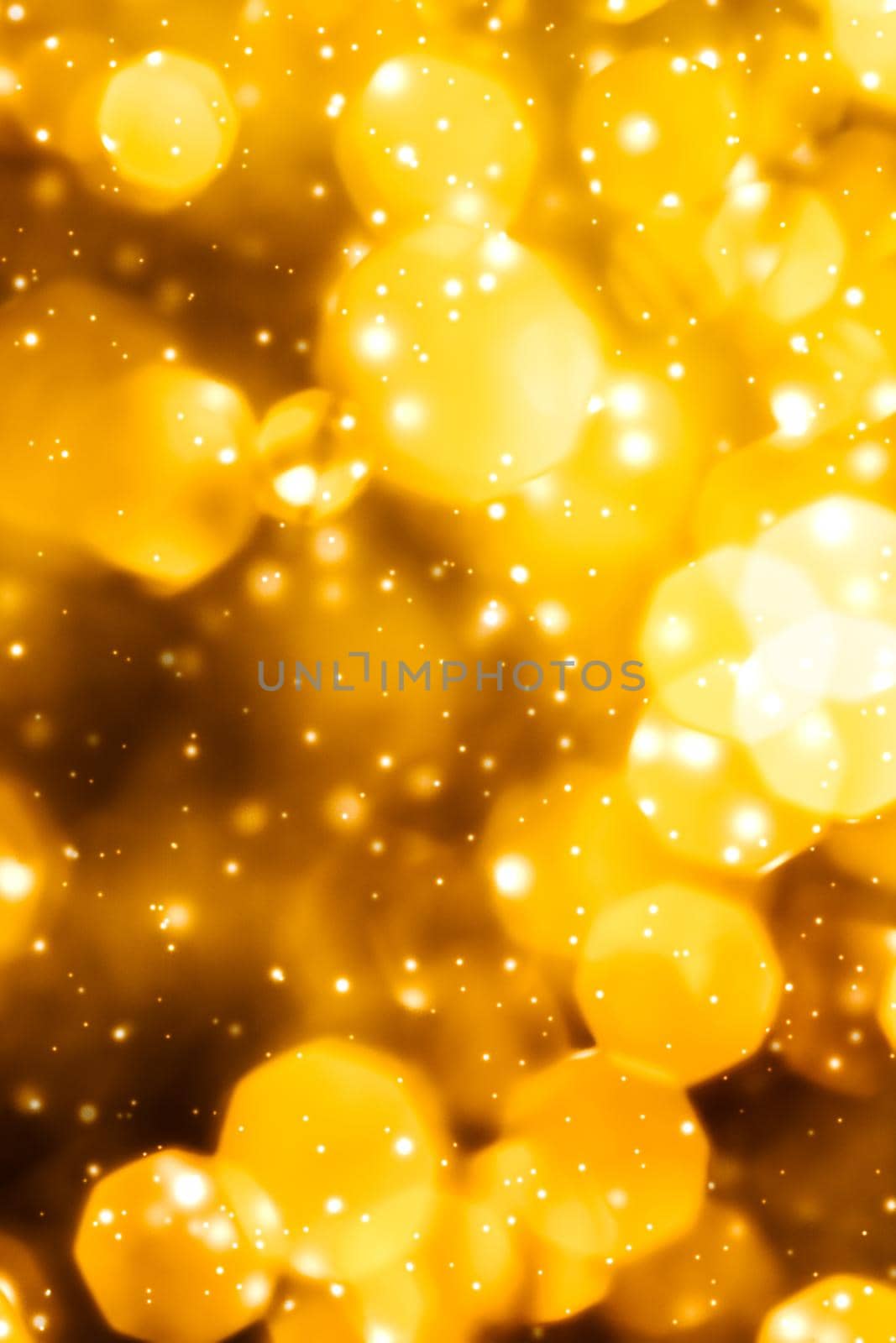 Golden Christmas lights, New Years Eve fireworks and abstract texture concept - Glamorous gold shiny glow and glitter, luxury holiday background