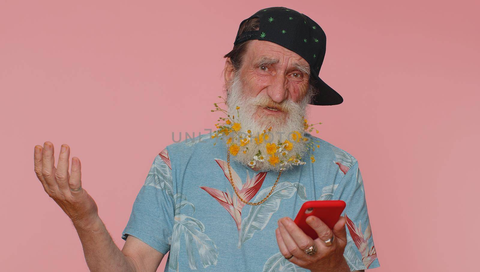 Happy excited joyful senior old man flowered beard use mobile cell phone typing browsing shouting say wow yes found out great big win, good news, lottery goal achievemen, celebrating success, winning