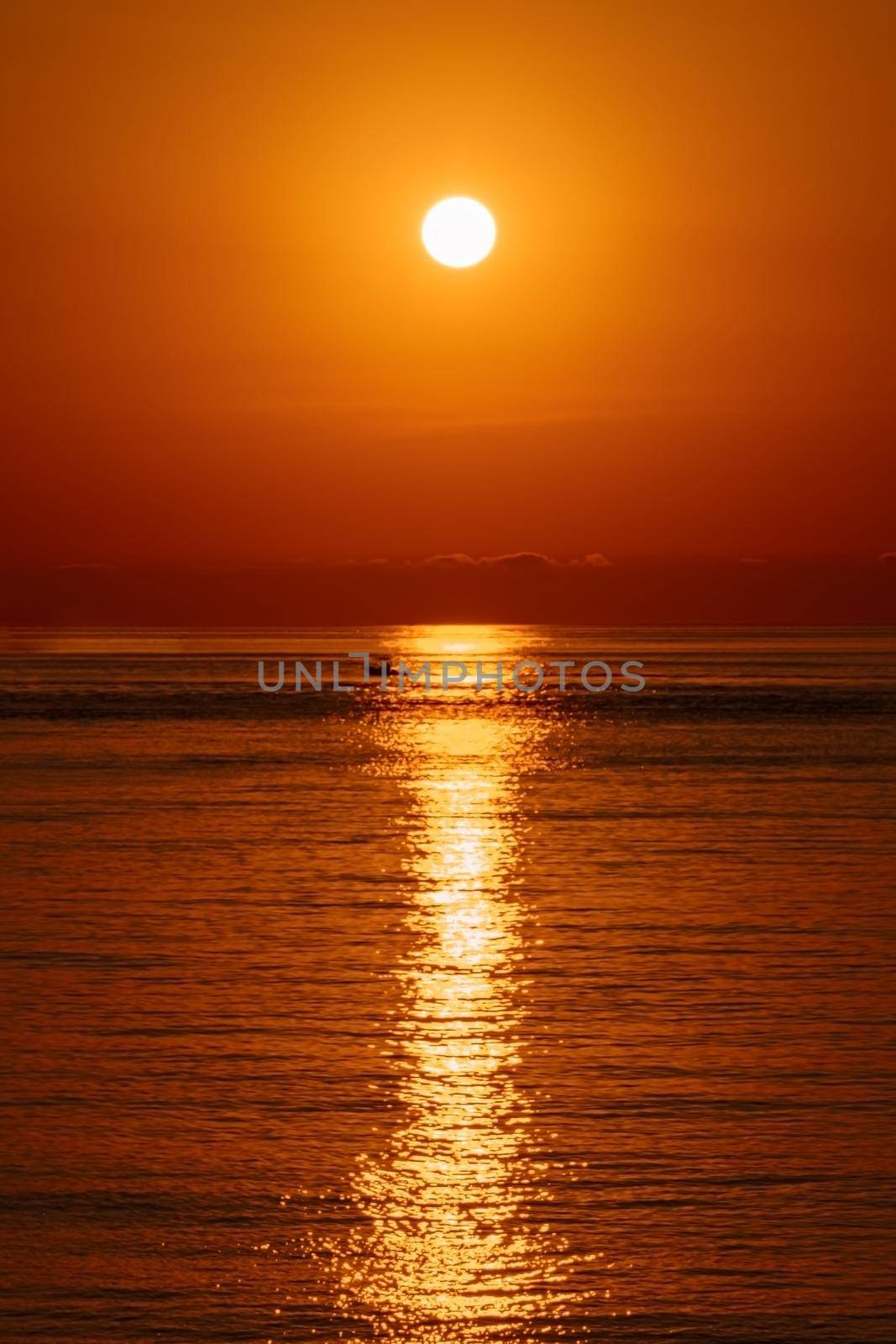 Meditation ocean and panoramic beach landscape. Orange and golden skylight calmness relaxing summer mood. Sunset sky reflecting in the water, aerial view. Travel destinations concept. .. by photolime