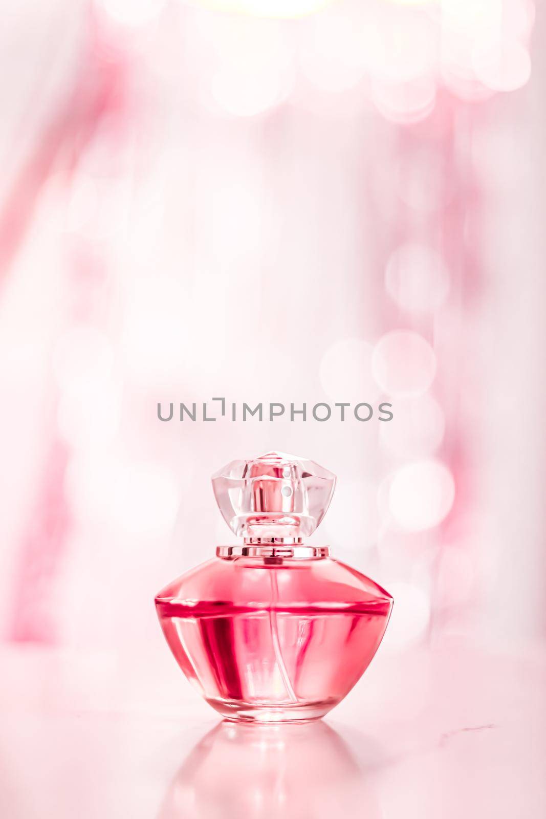 Perfume bottle on glamour background, floral feminine scent, fragrance and eau de parfum as luxury holiday gift, cosmetic and beauty brand present concept