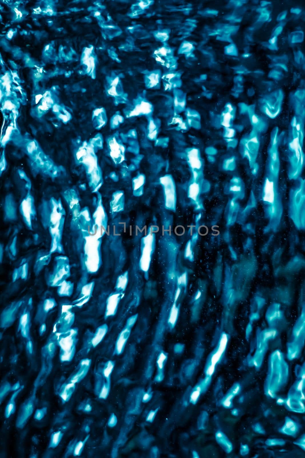 Abstract blue liquid surface as background - futuristic design and science concept. Deep blue waters