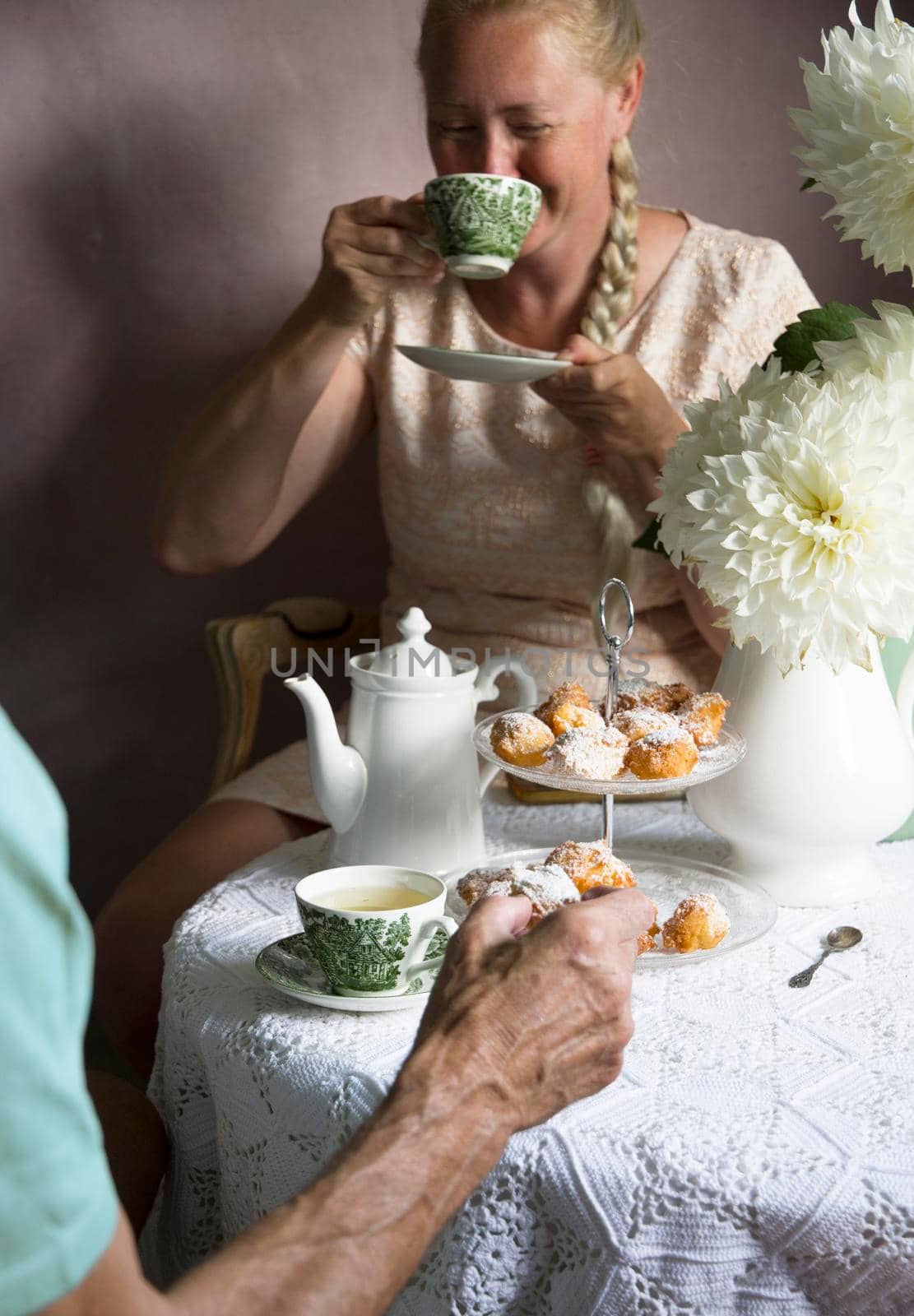 tea break in the English style,still life with flowers and donuts in the morning by KaterinaDalemans