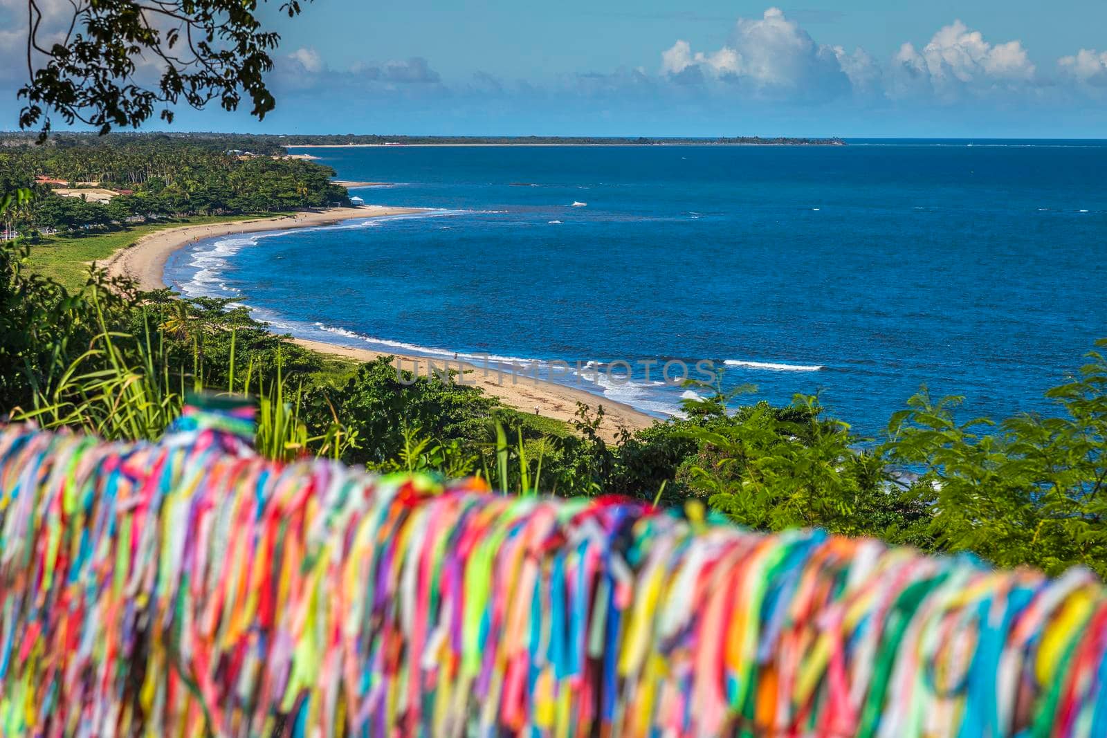 Beach and Colorful Lord of Bonfim ribbon tapes symbol of faith and good luck in Trancoso, BAHIA