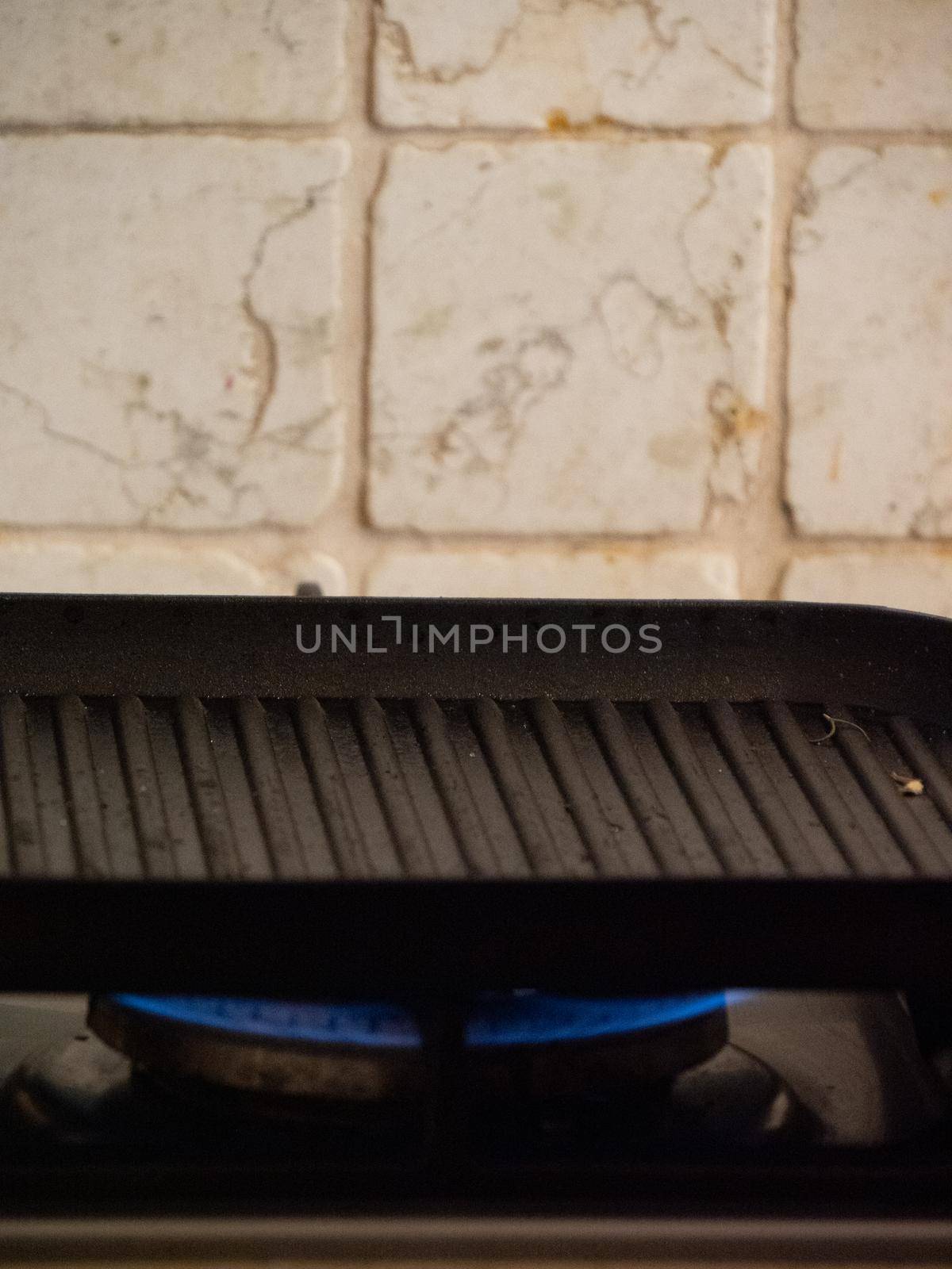 preparing a grill for cooking with heat and olive oil