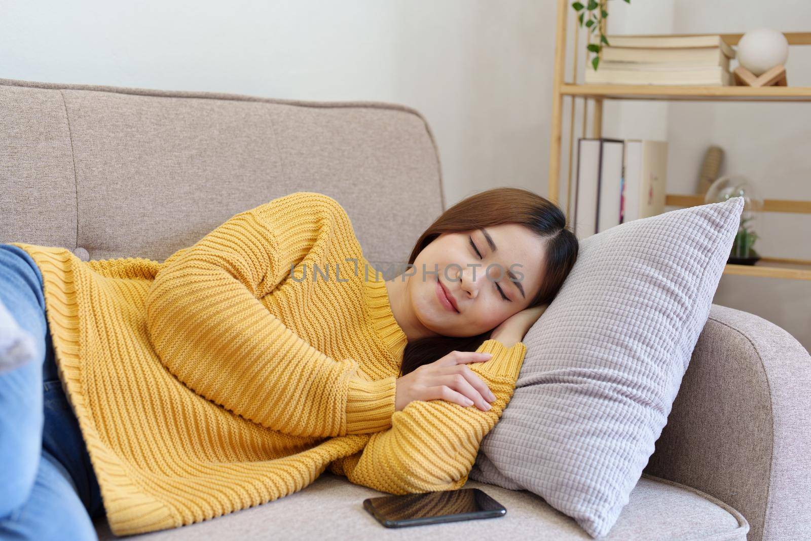 woman resting on the sofa at home.