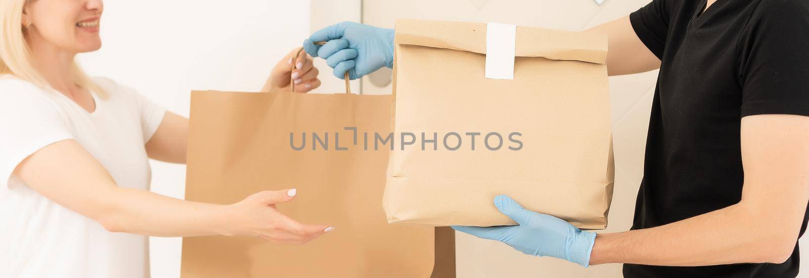 delivery man in protective gloves and a mask.