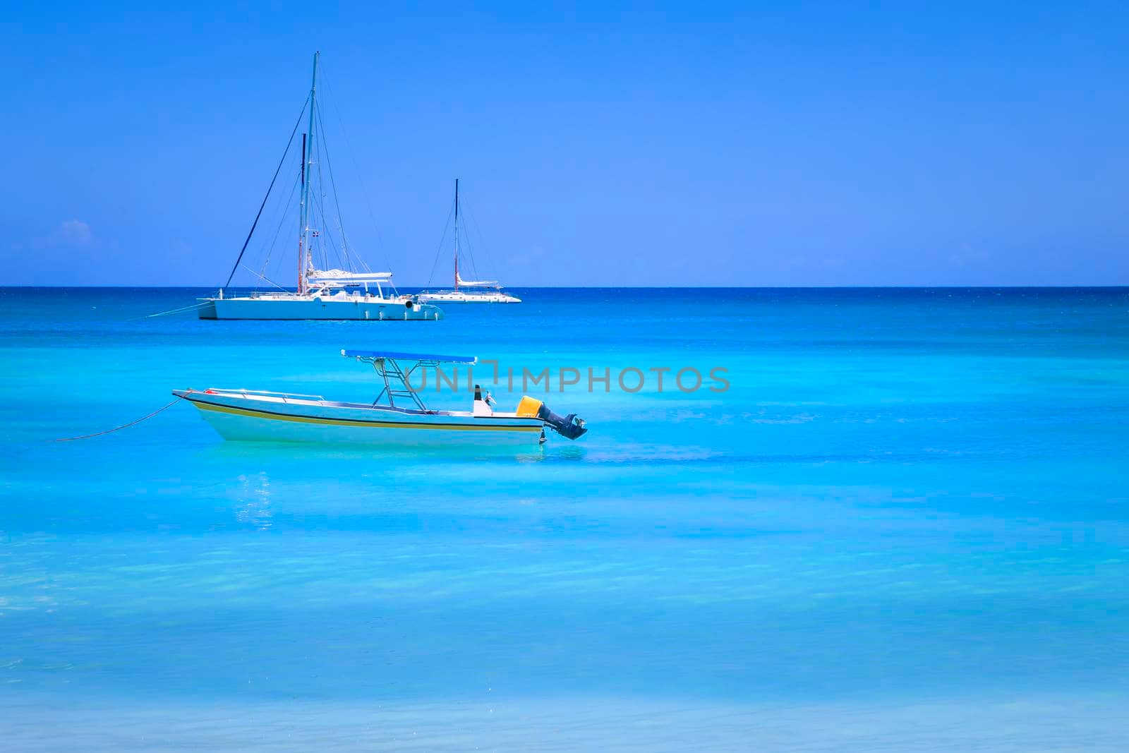 Tropical paradise, idyllic caribbean beach with sailboats, Punta Cana, Dominican Republic