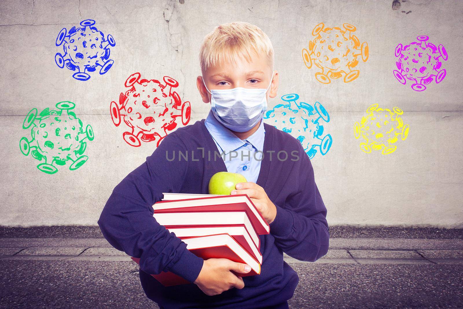 Young boy with protection mask against corona virus at school. by Taut