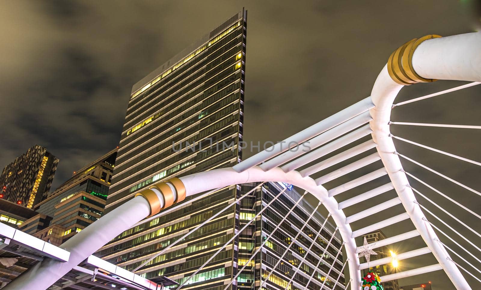 sky walk bridge at Chong Nonsi sky train station, Sathorn cityscape business zone Bangkok, Thailand.