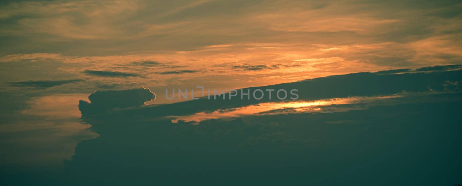 Beautiful sunset sky above clouds. Orange sunset sky. Beautiful sky. Dramatic red yellow pastel color at sunset. by Petrichor