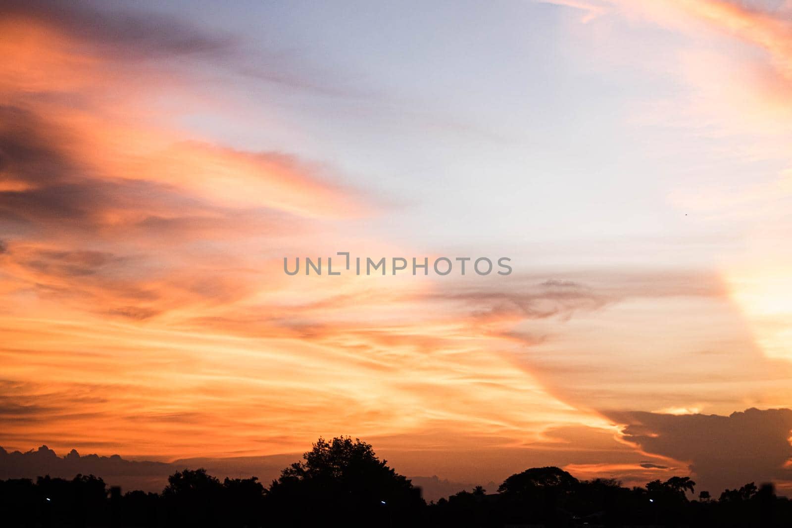 Beautiful sunset sky above clouds orange sunset sky. Beautiful sky. Dramatic red yellow pastel color at sunset.