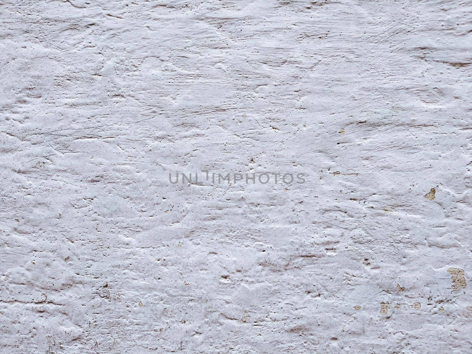 White textured stucco wall background. White stucco wall. Background of a white stucco coated and painted exterior, rough cast of cement and. White background. Abstract  wall grunge stone.