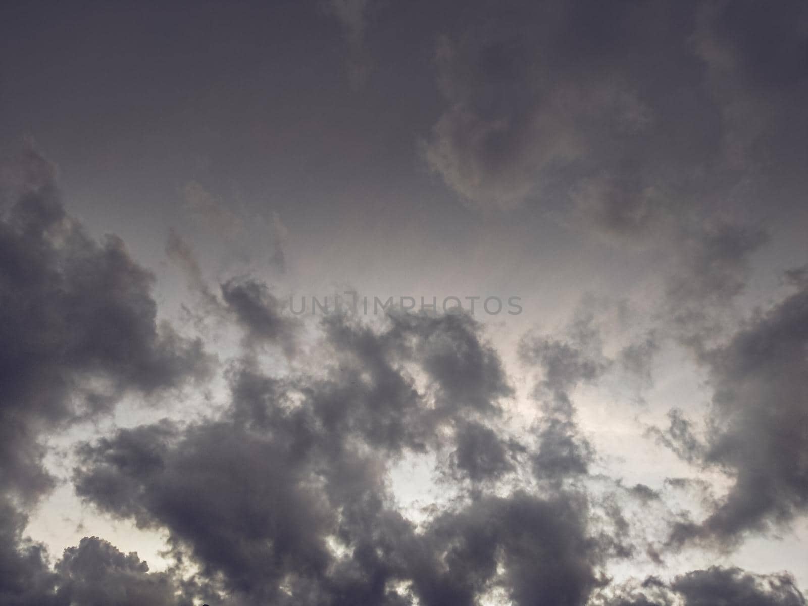 Rainy storm clouds Dark cloud sky environment abstract weather rain season. by Petrichor