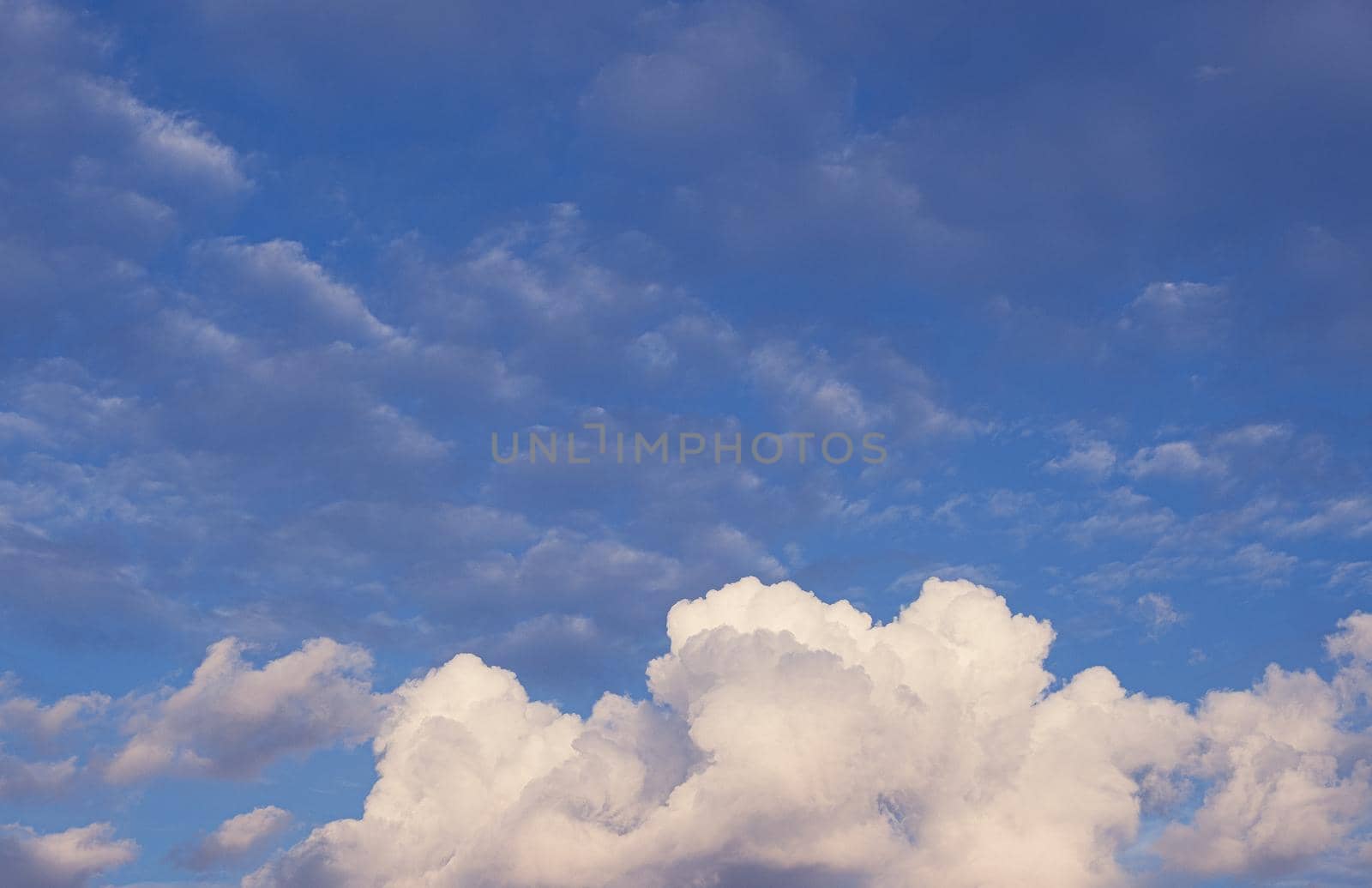 Huge white fluffys clouds sky background with blue sky background