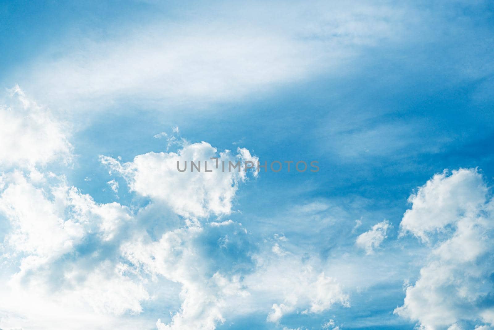 white fluffy clouds sky background with blue sky background for copy space. by Petrichor
