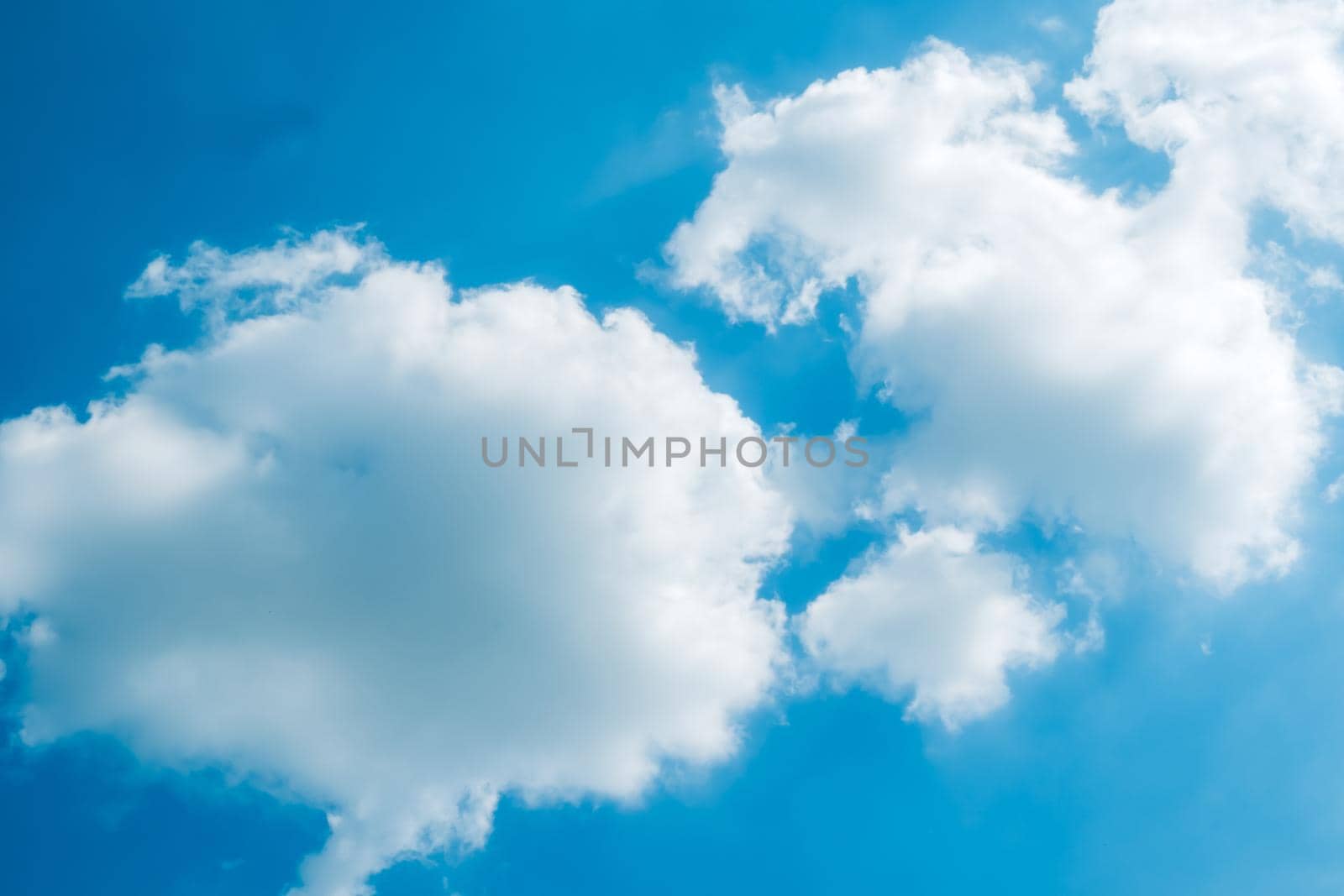 white fluffys clouds sky background with blue sky background for copy space by Petrichor