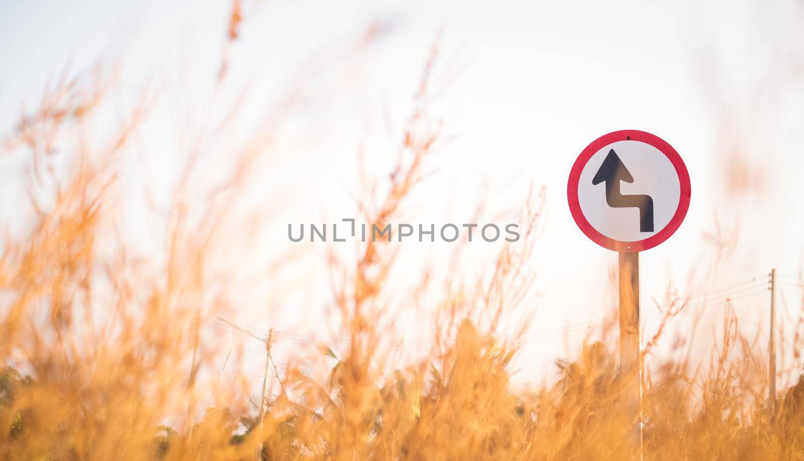Traffic street  transportation sign over dried grass nature meadow field