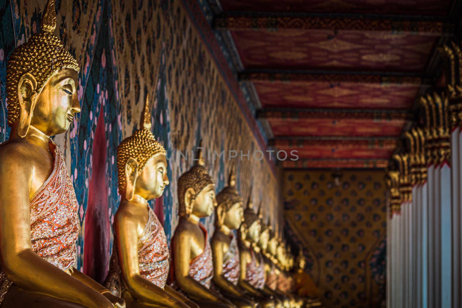 Row of Buddha image in meditation posture