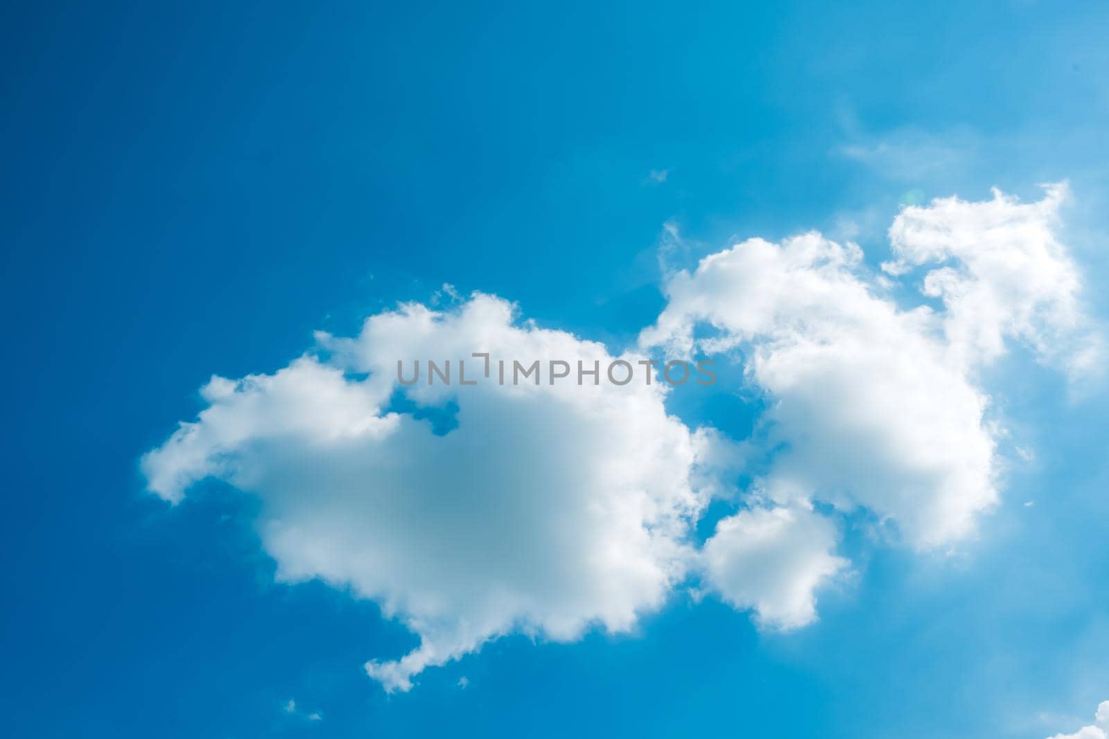 white fluffys clouds sky background with blue sky background for copy space. by Petrichor