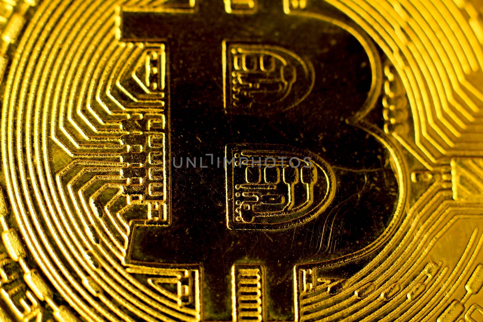 Macro closeup photography of bitcoin gold on black background.