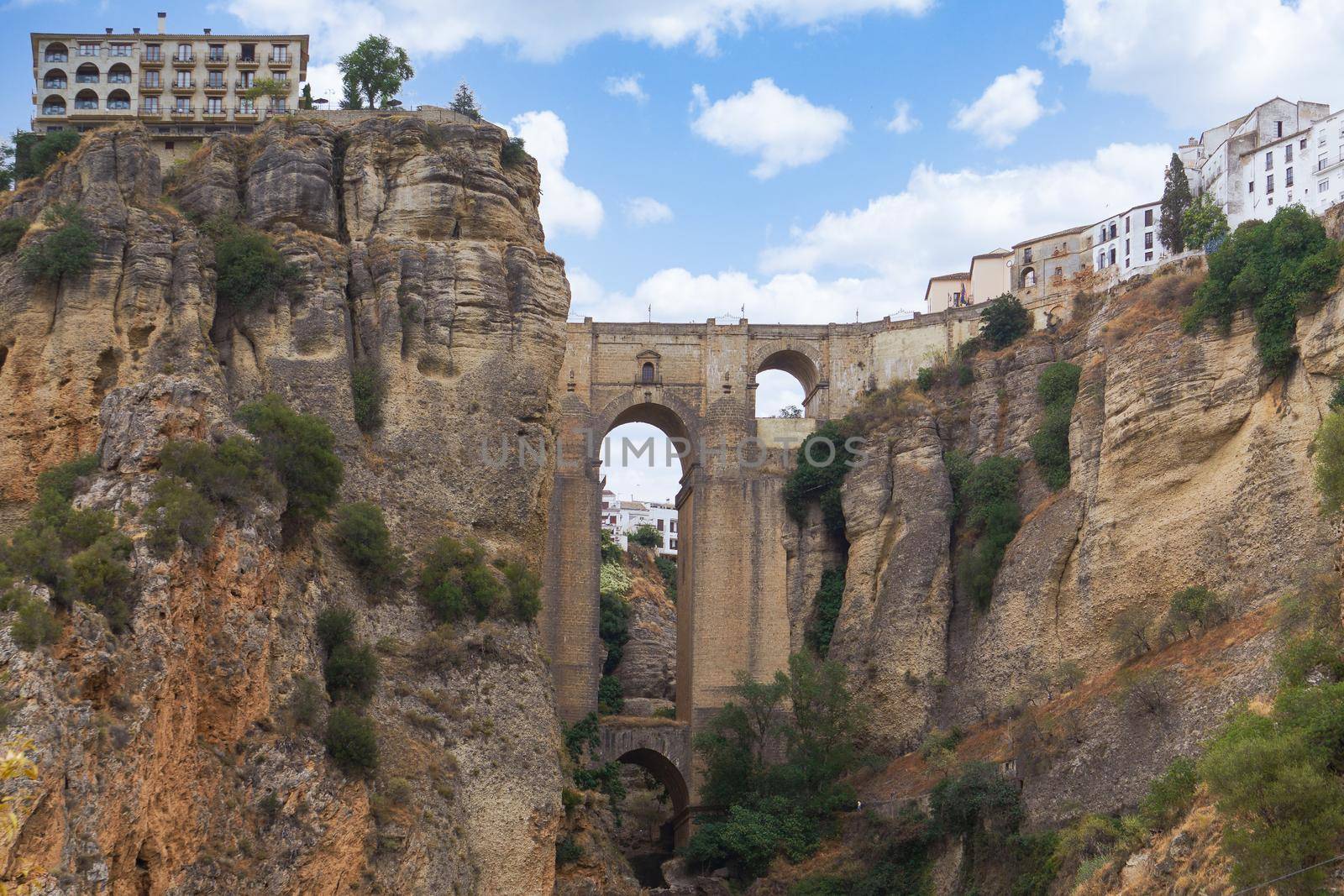 views from the river of the new bridge of Ronda over the cliff .Andalusia, Spain