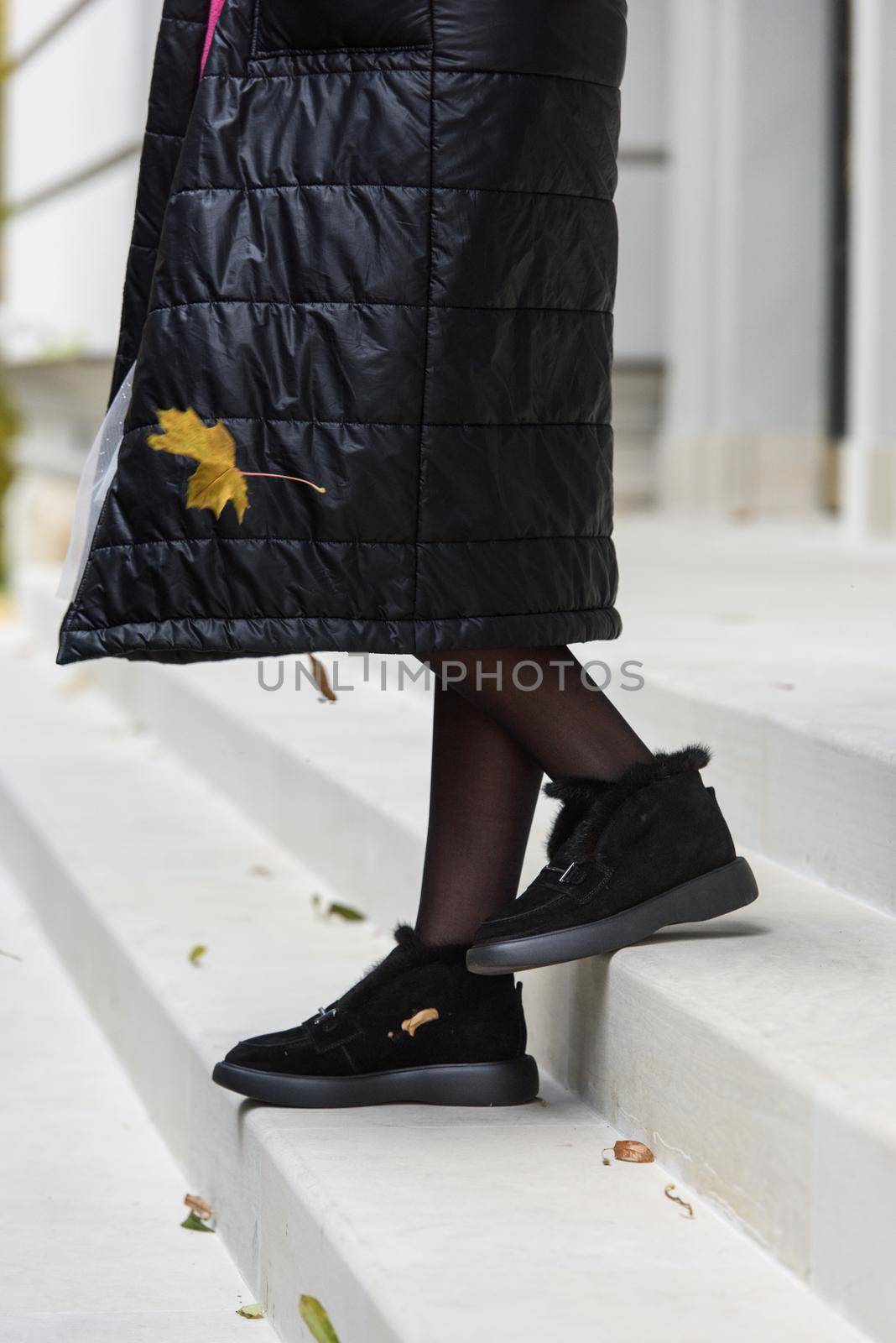 Female fashion shoes. Black boots with fur by Ashtray25