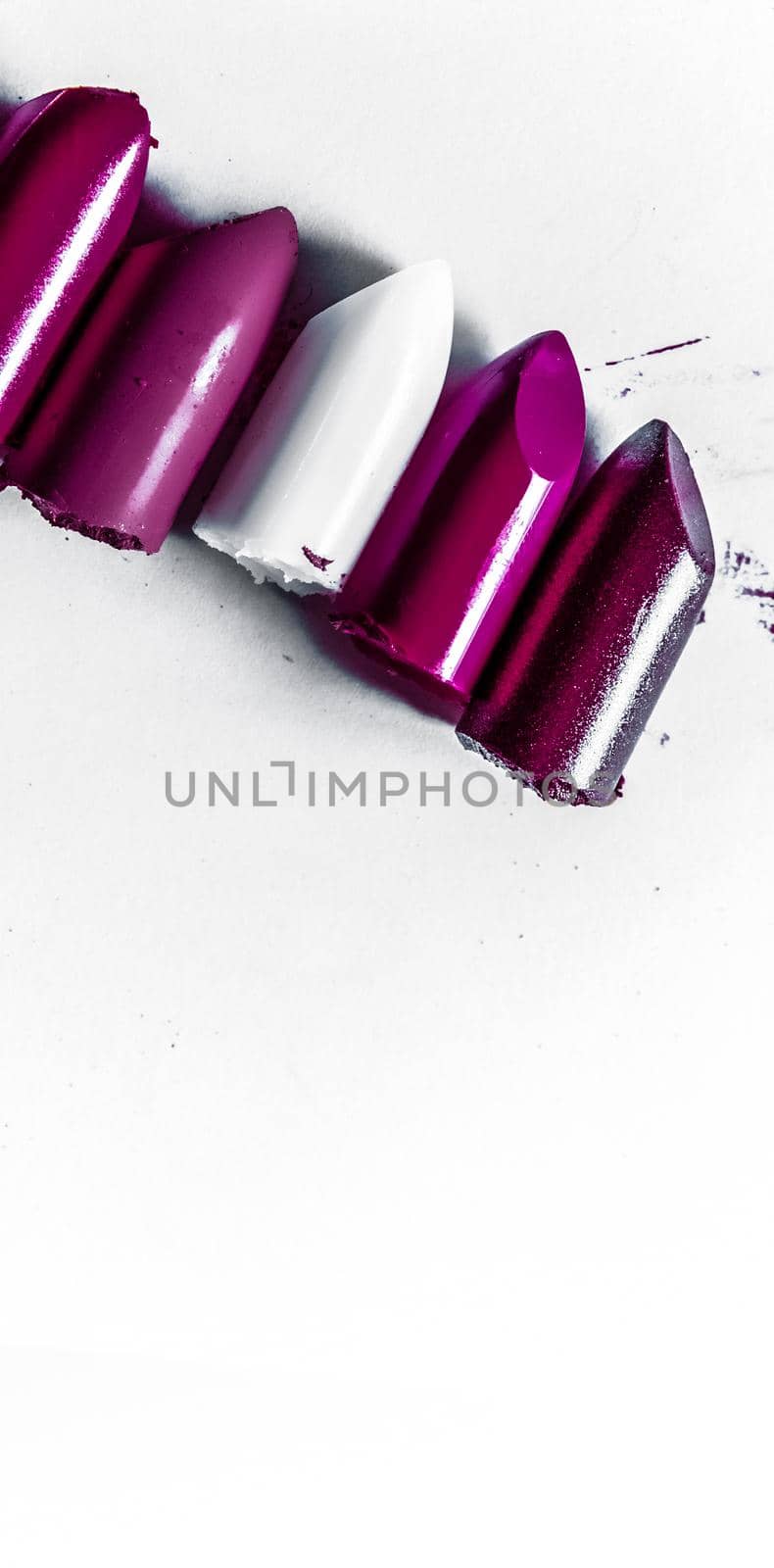 Cutted lipstick close-up isolated on white background by Anneleven