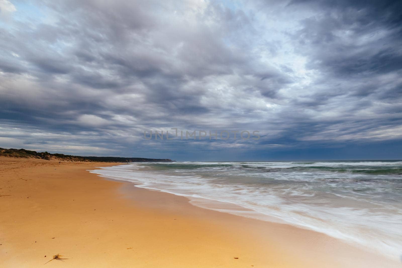 Boag Rocks at Gunnamatta Ocean Beach on a stormy afternoon in St Andrews Beach in Victoria, Australia