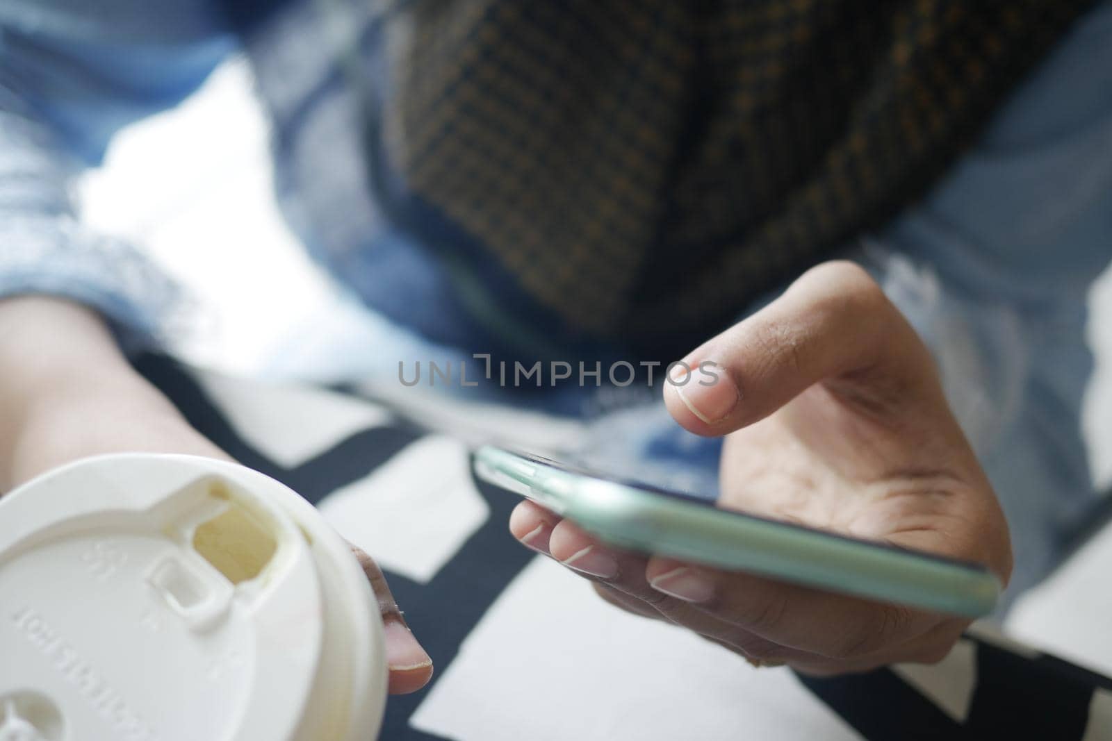 close up of women hand holding smart phone.