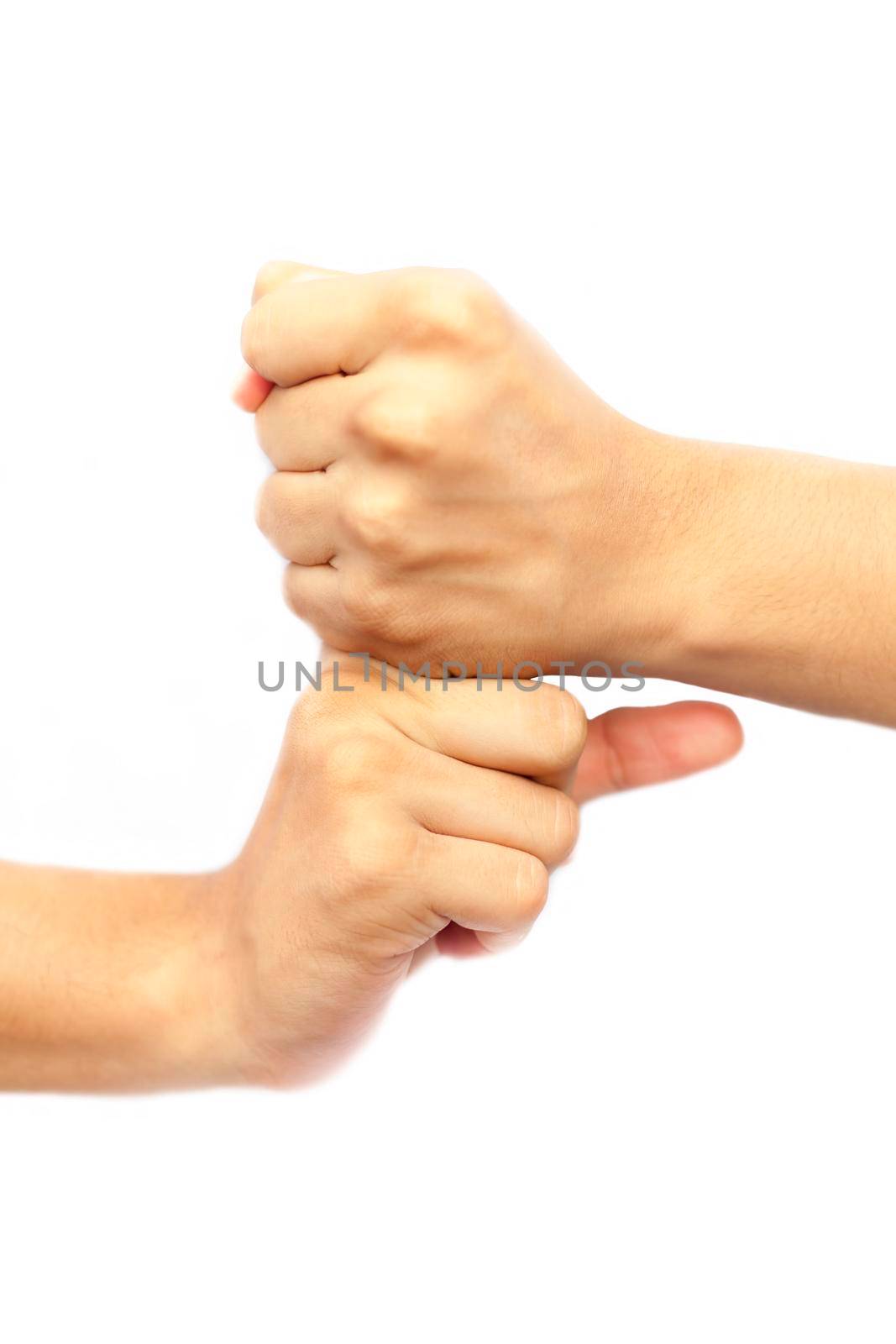 Shot of pair of human hands doing Vajra Yoga Mudra isolated on white background. Vertical shot of hands demonstrating Vajra Mudra.