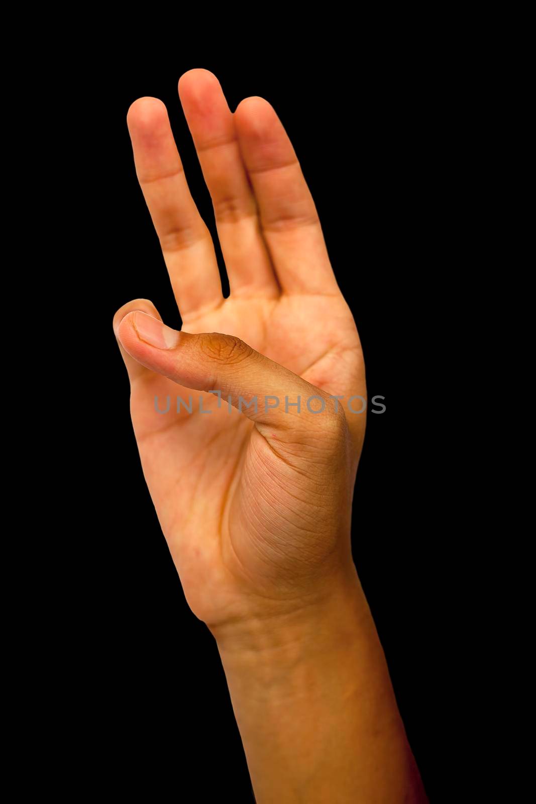 Shot of male hands demonstrating the Bhudy Yoga Mudra. Bhudy Yoga Mudra with pinky touched to thumb forming the mudra isolated on a black colored background. Vertical shot. by mirzamlk