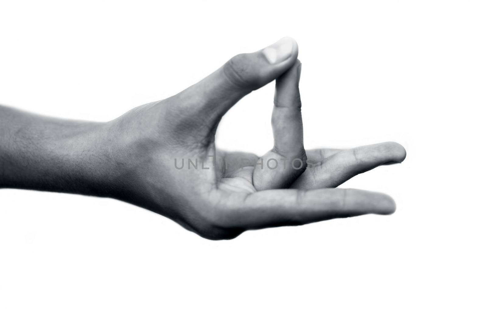 Human hand doing Akash Yoga Mudra isolated on a white-colored seamless background. Shot of single-hand demonstrating Akash Mudra. by mirzamlk