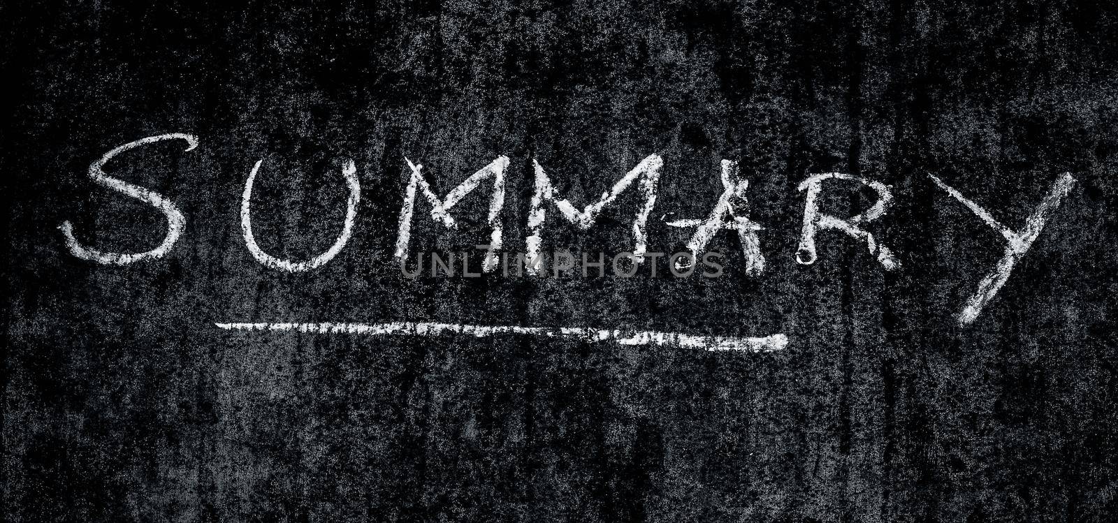 Creative shot of Summary word written on a rough wall with an underline under it.