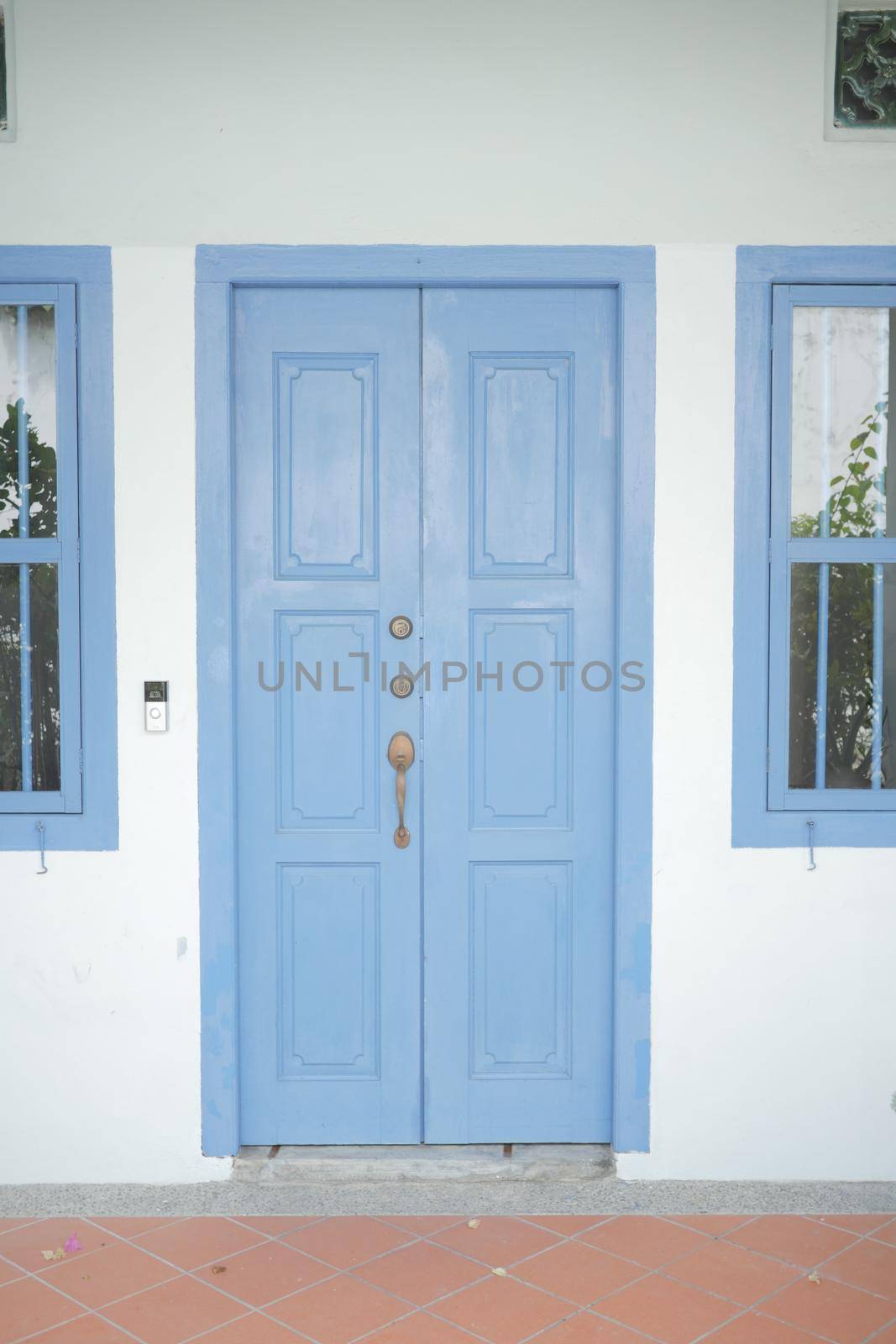 a blue wood old door in singapore .