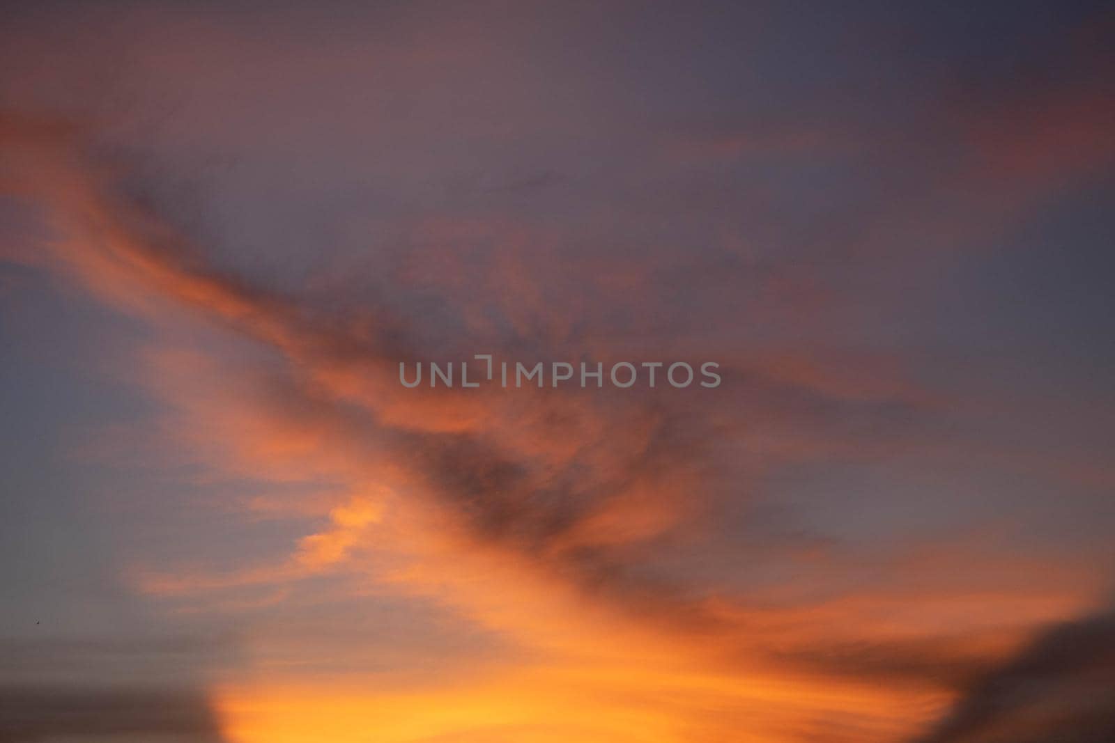 Beautiful sunset sky above clouds orange sunset sky. Beautiful sky. Dramatic red yellow pastel color at sunset.