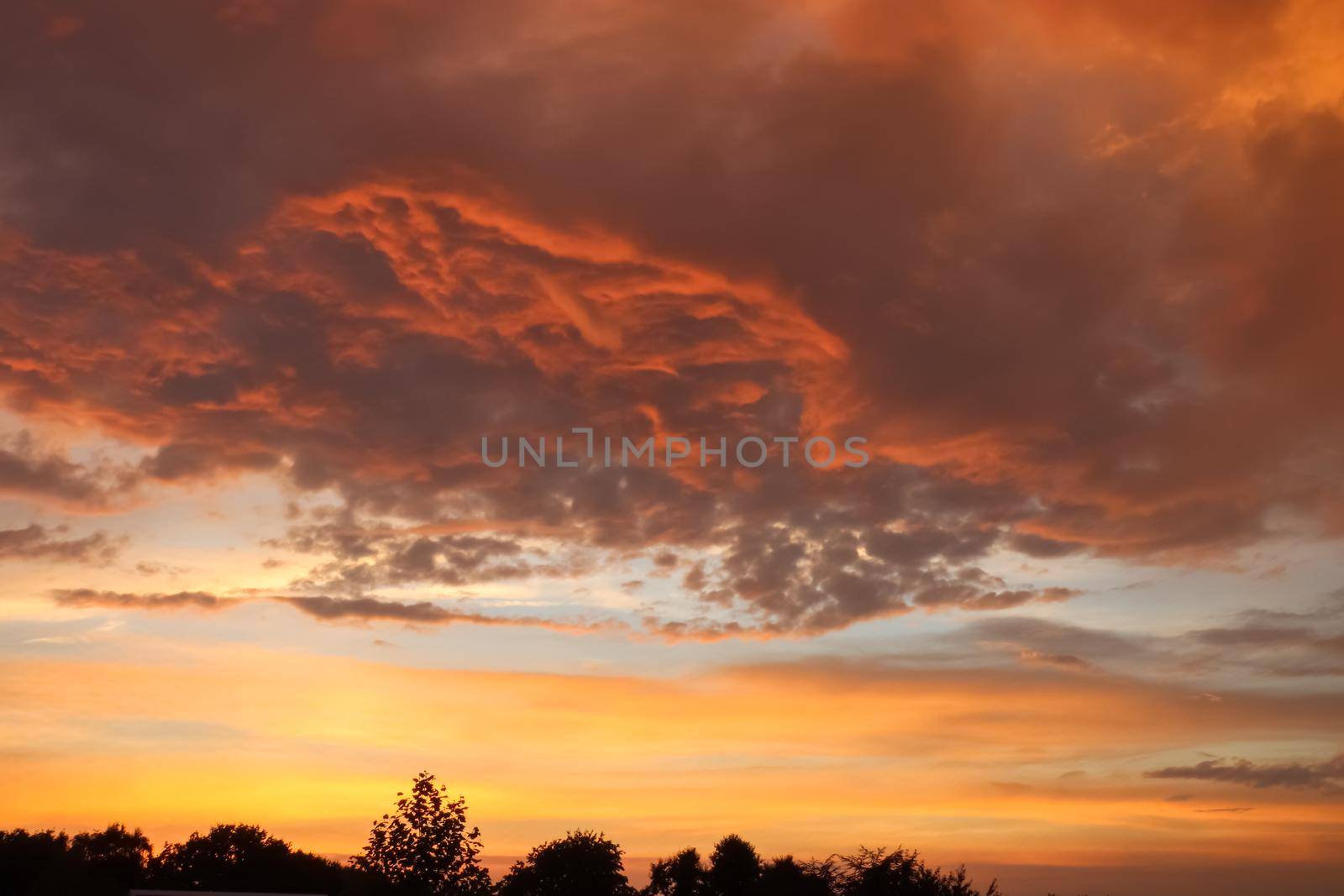 Beautiful orange and yellow clouds at sunrise and sunset in the sky. by MP_foto71