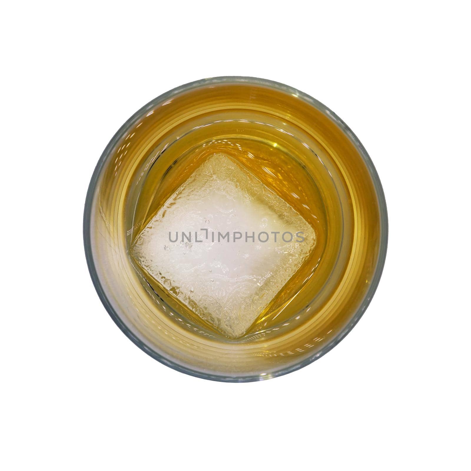 Top view of a clear glass of whisky with two round ice cubes isolated on a white background