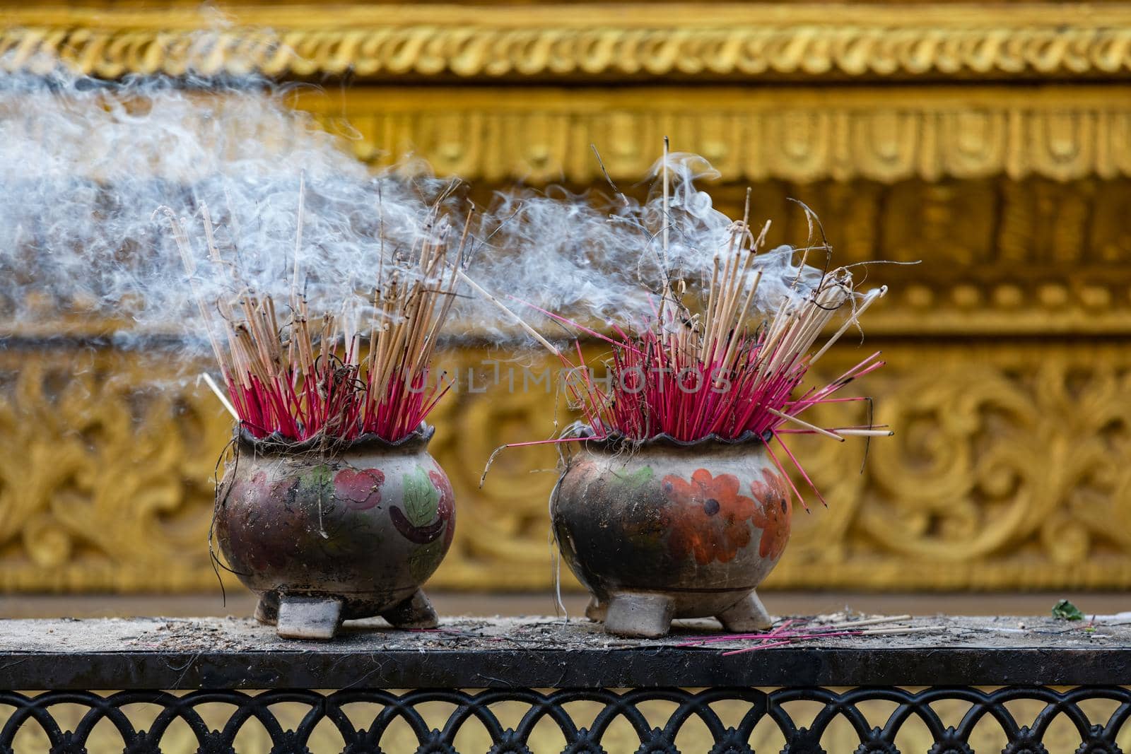 Incense sticks in the Temple of the Four Seated Buddhas of Kyaikpu in Bago