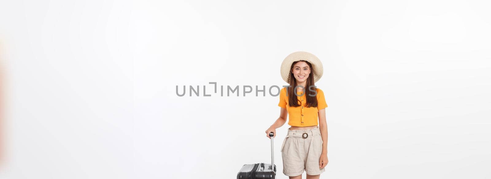Woman tourist. Full length happy young woman standing with suitcase with exciting gesturing, isolated on white background