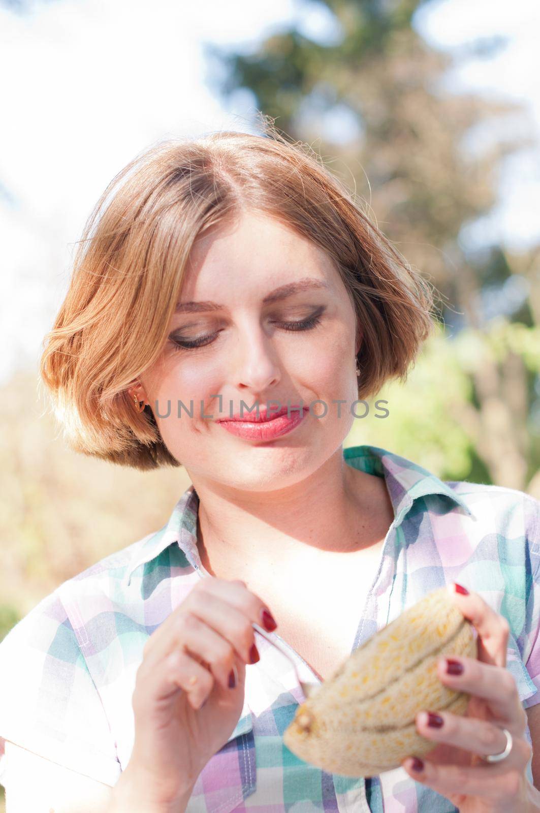 beautiful young caucasian girl in pin-up clothes, eat fresh melon on picnic, woman healthy lifestyle. High quality photo