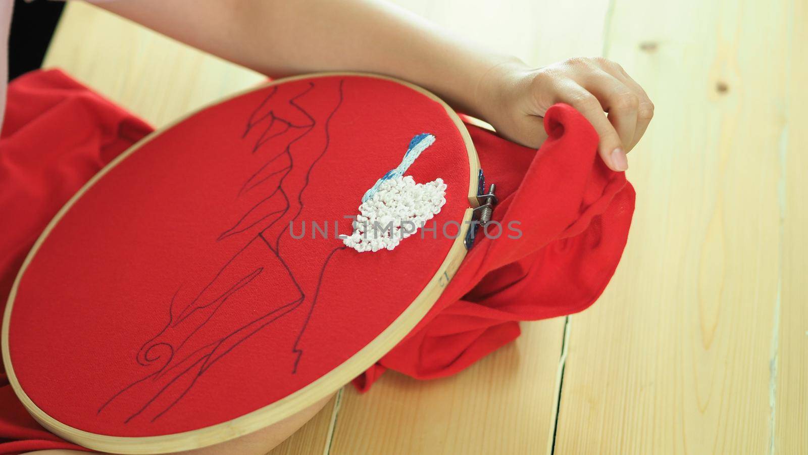 Woman hands and craft work. Embroider sewing by hand. Handicraft work by thread needle sew knit. Wood frame embroidery hoop. Needlework handicraft crafting quarantine leisure concept. 