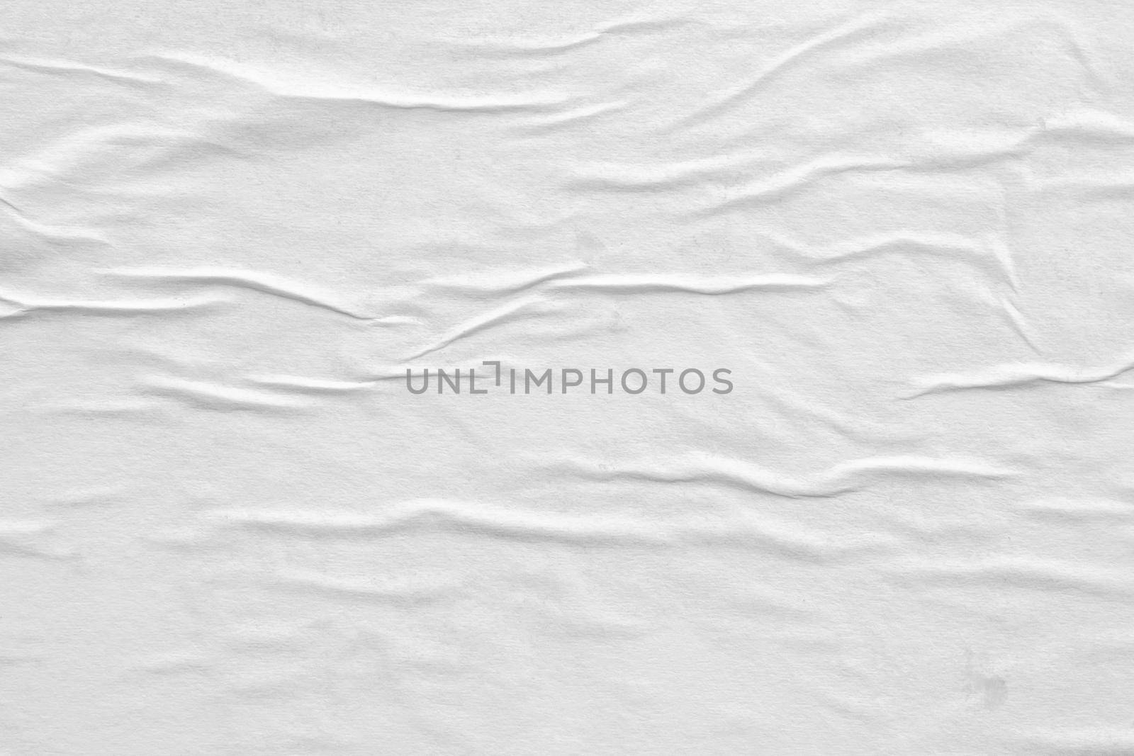 Blank white crumpled and creased paper poster texture background