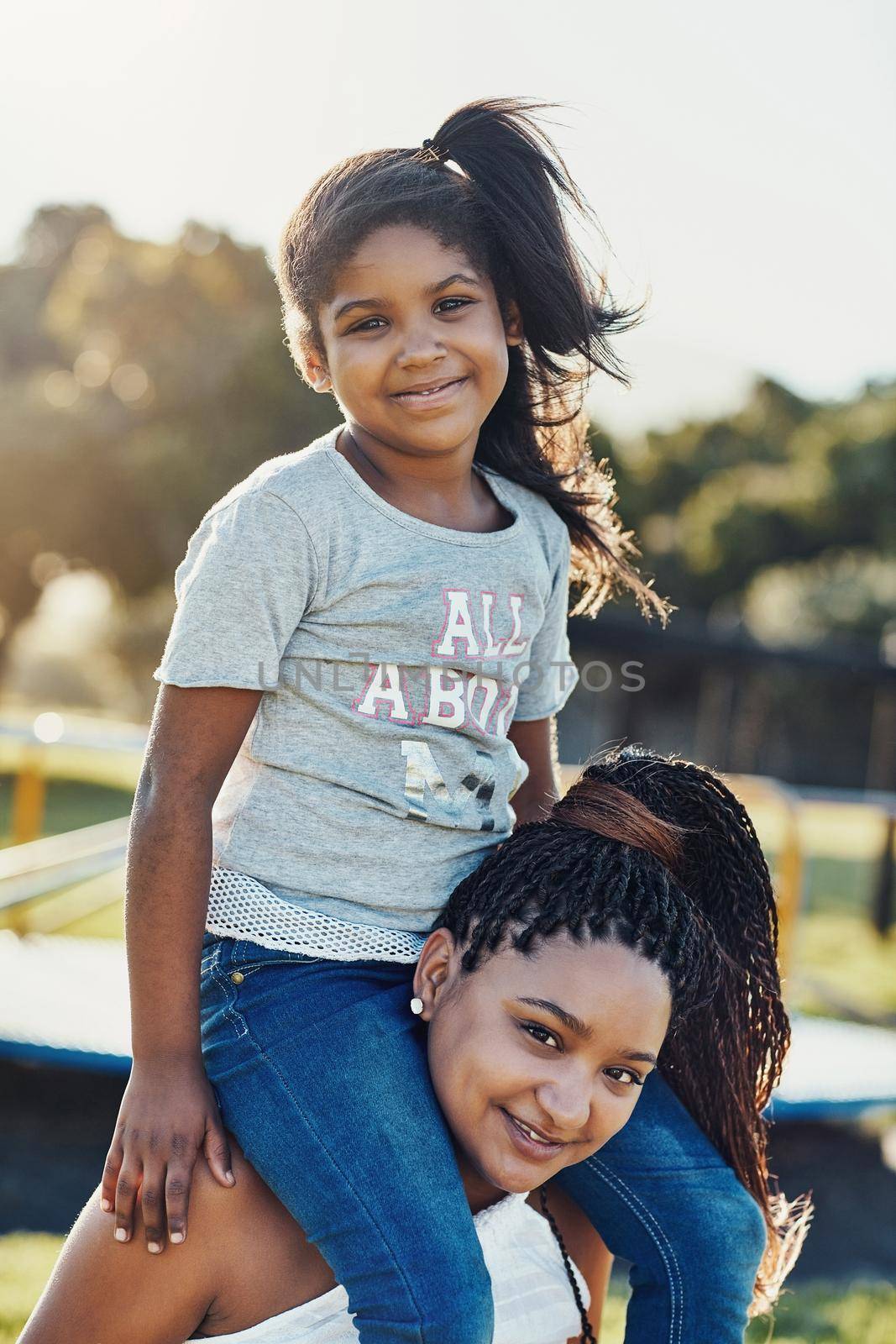 She loves playing in the park. Cropped portrait of a mother bonding with her daughter outdoors. by YuriArcurs