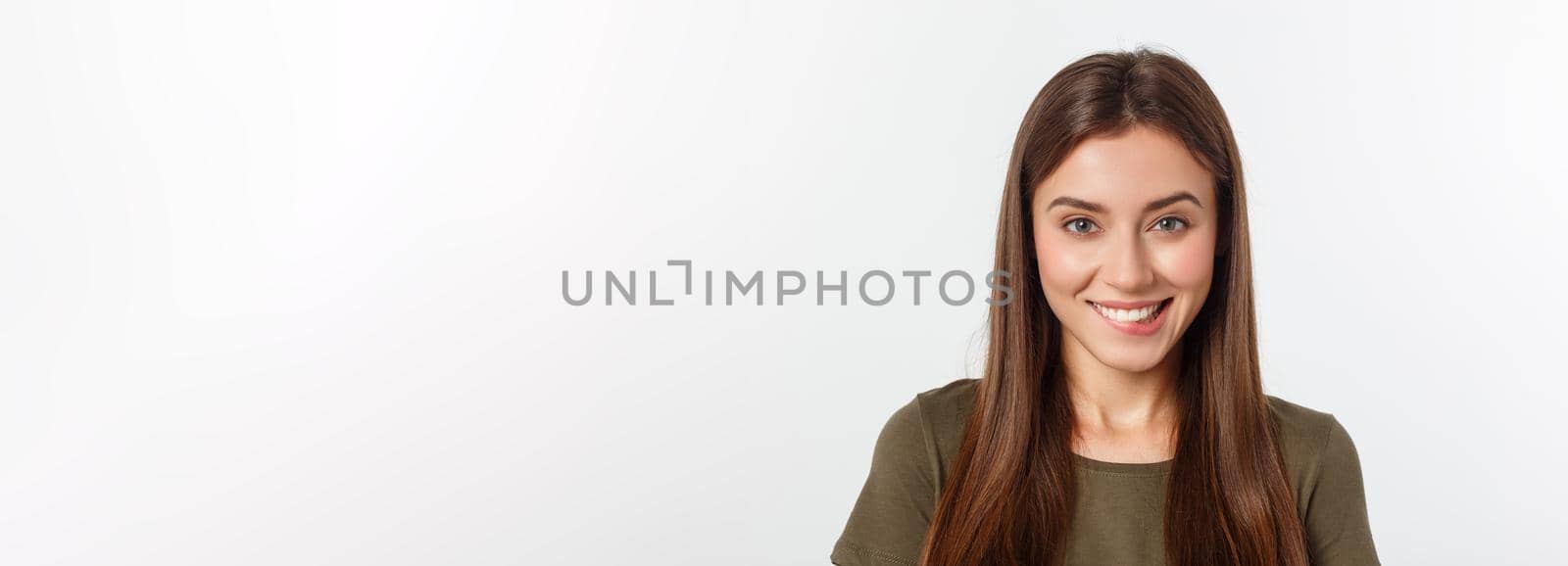 Close-up portrait of yong woman casual portrait in positive view, big smile, beautiful model posing in studio over white background