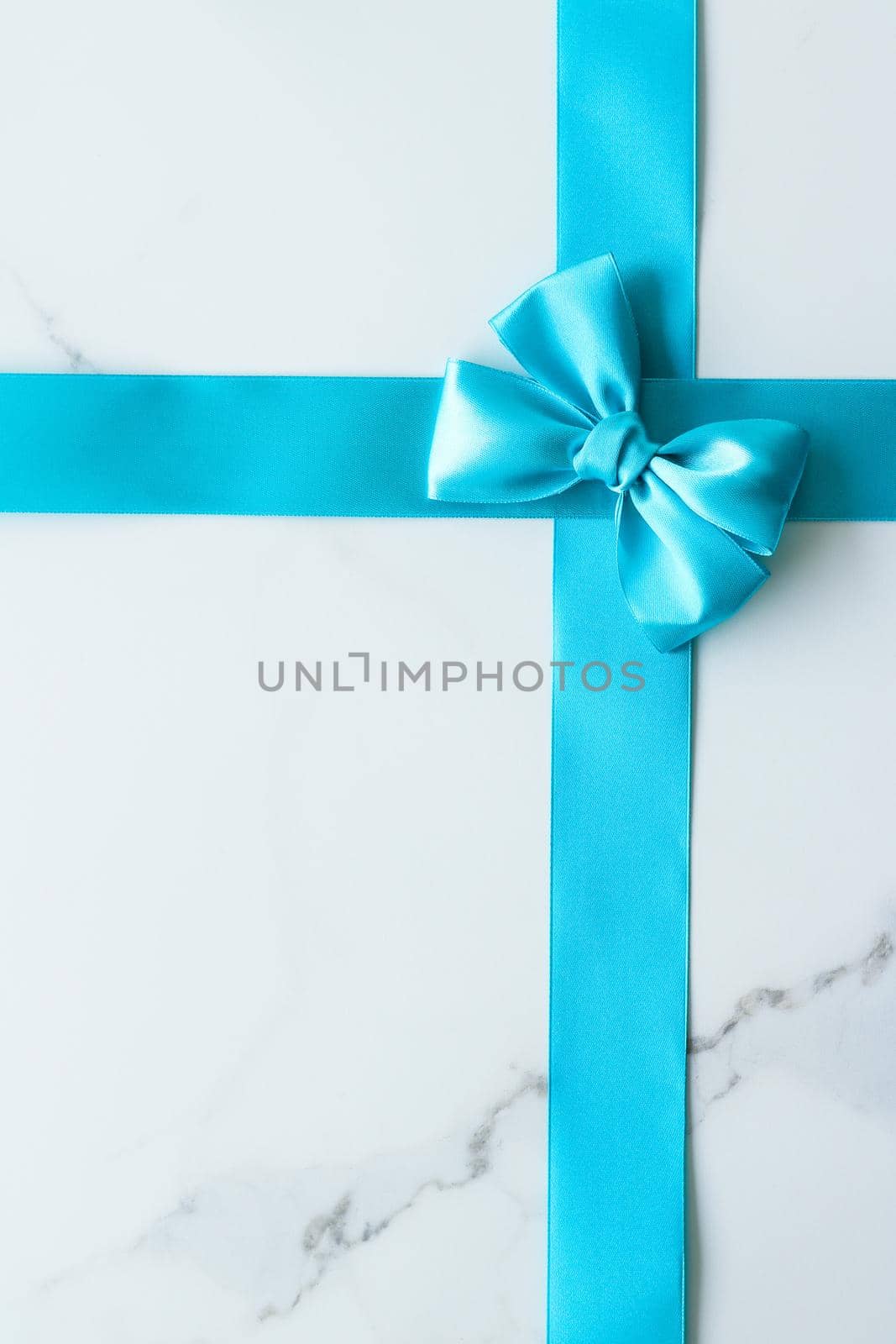 Holiday decor, feminine design and flatlay concept - Blue silk ribbon on marble, top view